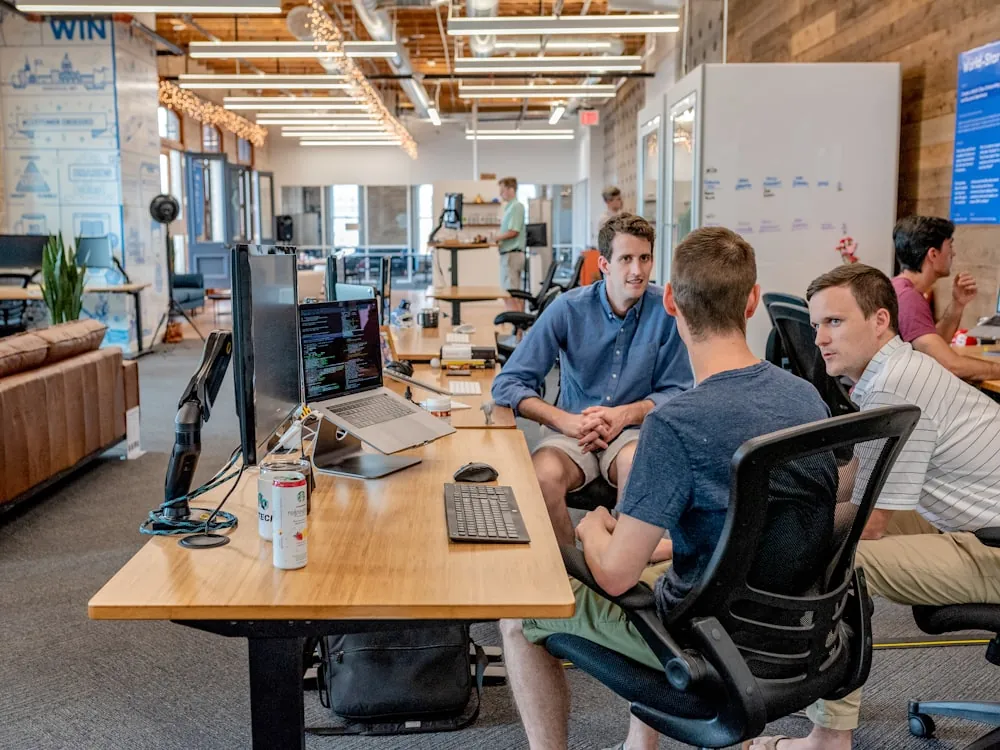 Professional team reviewing the Dynagest company profile together