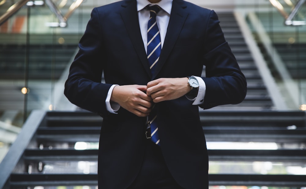 Business professional in a corporate lobby before a documentation review